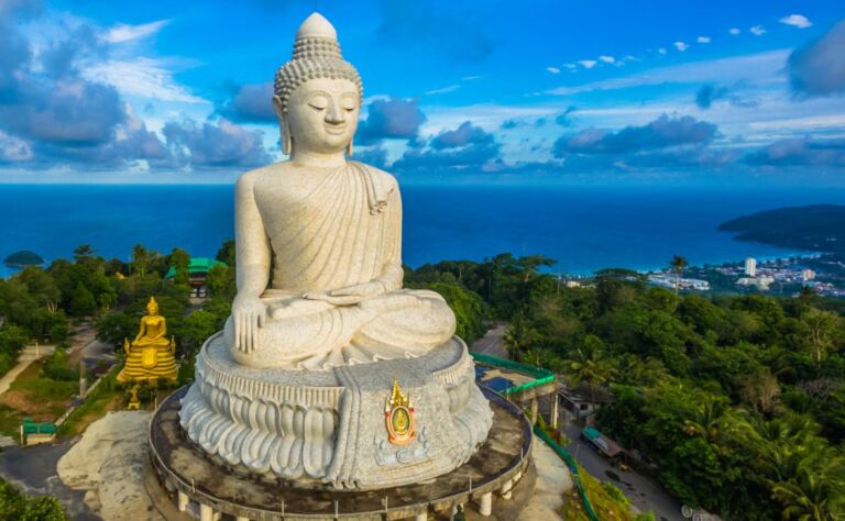 blue sky and blue ocean are on the back of Phuket Big Buddha statue.white Phuket big Buddha is the one of landmarks on Phuket island.