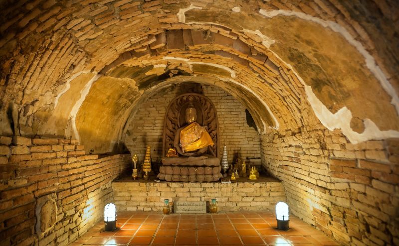 Buddha statue in one of the underground tunnels at Wat Umong, Chiang Mai, Thailand
