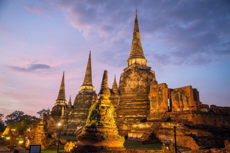 the Wat Phra Si Sanphet at sunset in the City Ayutthaya in the Province of Ayutthaya in Thailand