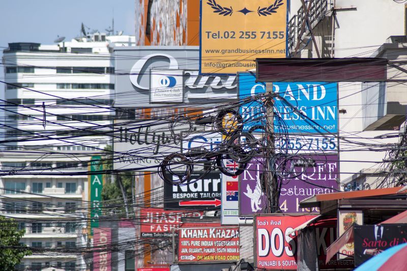Signage above Sukhumvit Road, in the central district of Bangkok, Thailand