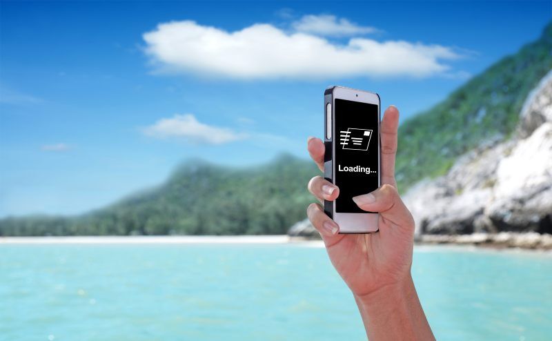 Phone showing no wifi reception on tropical island beach