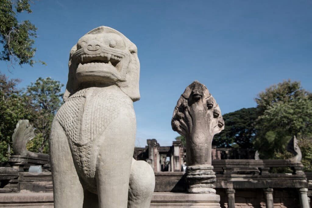 Singha and Naga guarding the entry bridge to Phimai temple complex, Thailand