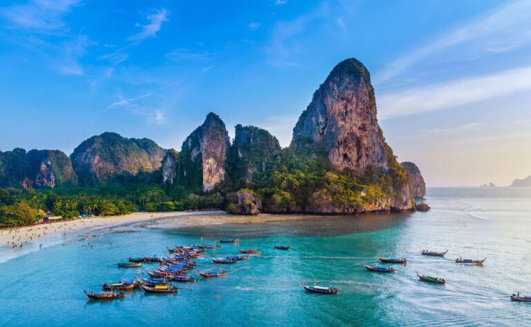 Railay beach with long tail boat in Krabi, Thailand.