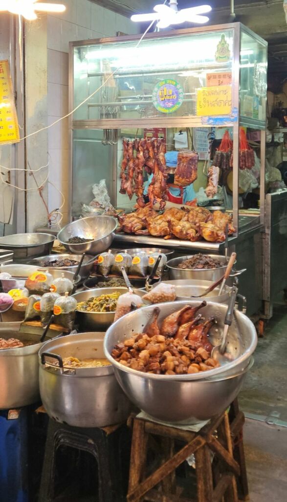 Chinatown food stall with pork and chicken on display