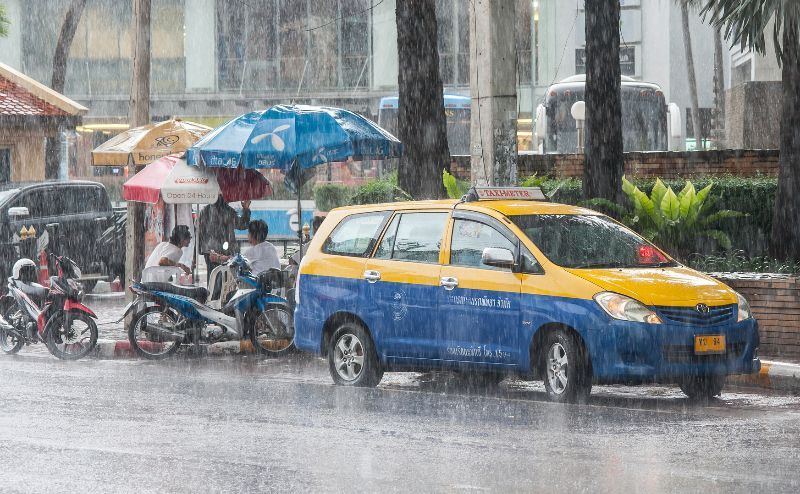 Pattaya street during heavy tropical storm rain in monsoon season.