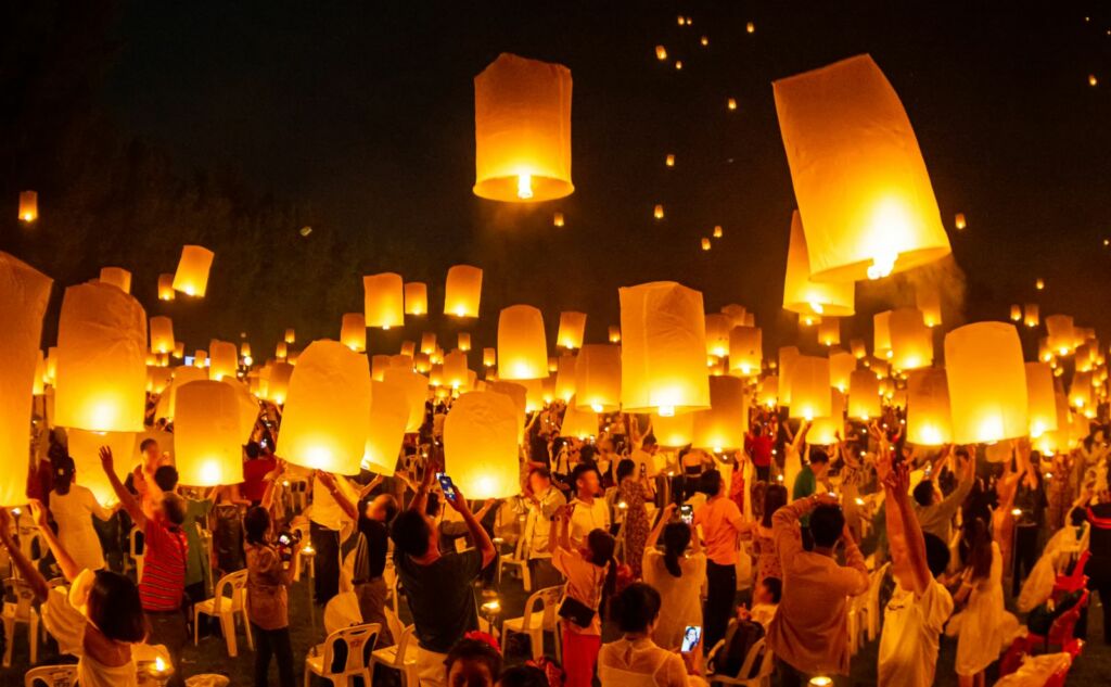 Floating lanterns on sky in Loy Krathong Festival or Yeepeng Festival , traditional Lanna Buddhist ceremony in Chiang Mai, Thailand NuwatPhoto