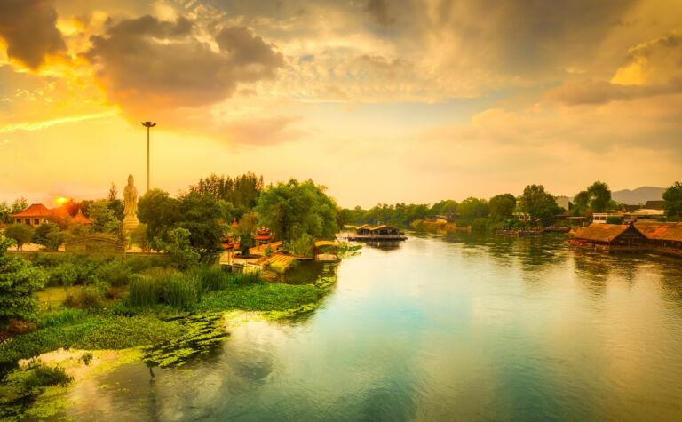 Kanchanaburi riverfront restaurants at sunset