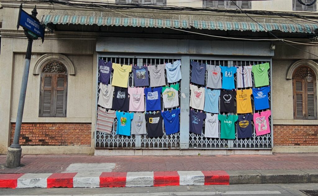 T-shirts on a building on Song Wat Road 