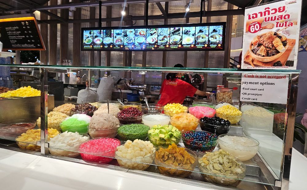 colourful bowls of Nam Kang Sai - Nam Kang Sai - jellies and fruits served with ice and sweet syrup