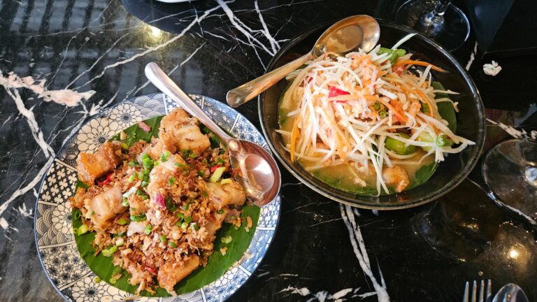 Thai food a Papaya salad and crispy pork