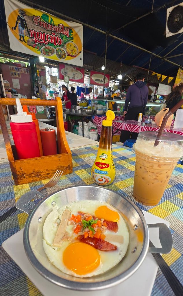 Pan eggs with iced coffee at a small stall behind the MRT station at Sam Yot